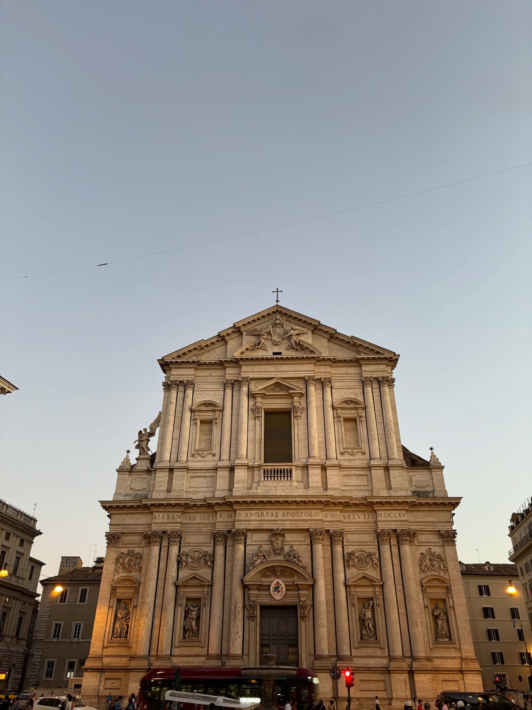 A baroque church facade under a clear sky